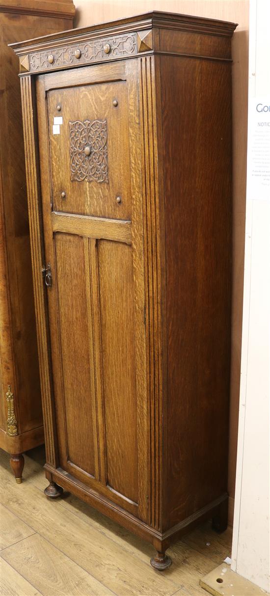 A 1930s oak hall cupboard, H.193cm